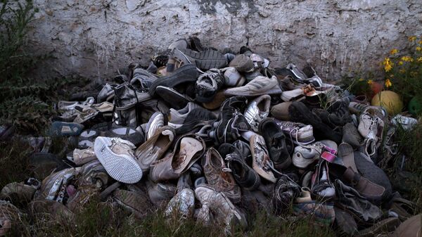 Migrants' shoes which were retrieved by artist Mohsen Lahzib, who tries to create beauty out of sorrow, at his space in the southern port town of Zarzis, Tunisia, on April 15, 2018.  - Sputnik International