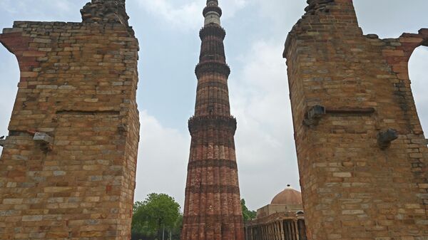 A visitor walks at the Qutub Minar archaeological complex after it was reopened for visitors, which was closed as part of measures to try and combat the spread of the COVID-19 coronavirus, in New Delhi on July 8, 2020. - India on July 6 became the country with the third-highest coronavirus caseload in the world, as a group of scientists said there was now overwhelming evidence that the disease can be airborne -- and for far longer than originally thought. - Sputnik International