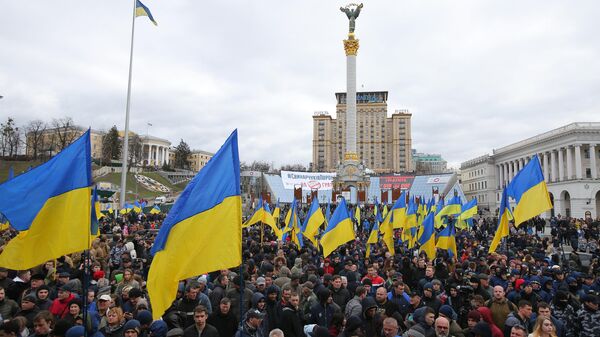 Demonstrators take part in a rally held by Ukrainian nationalist movements, who demand an investigation into top officials' activities suspected of corruption, at the Independence Square in Kiev, Ukraine. - Sputnik International