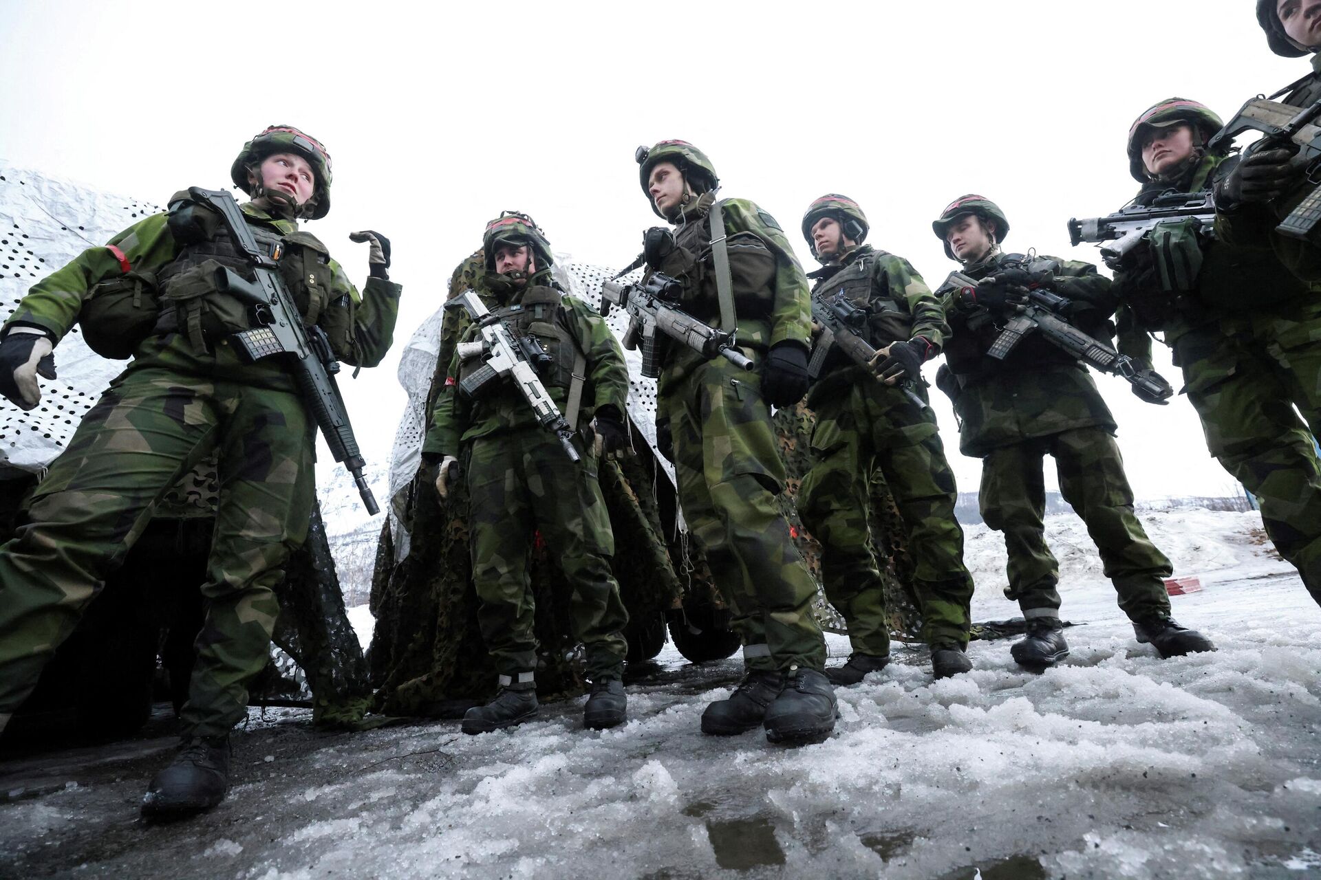 Swedish soldiers take part in a military exercise called Cold Response 2022, gathering around 30,000 troops from NATO member countries plus Finland and Sweden, amid Russia's invasion of Ukraine, in Evenes, Norway, March 22, 2022.  - Sputnik International, 1920, 19.04.2022