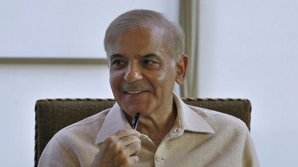 Pakistan's opposition leader Shahbaz Sharif smiles during a press conference, in Islamabad, Pakistan, Wednesday, March 30, 2022. Lawmakers appeared poised to push Prime Minister Imran Khan out of power in an upcoming no-confidence vote, after a small but key coalition partner abandoned him and joined the opposition. (AP Photo/Anjum Naveed) - Sputnik International
