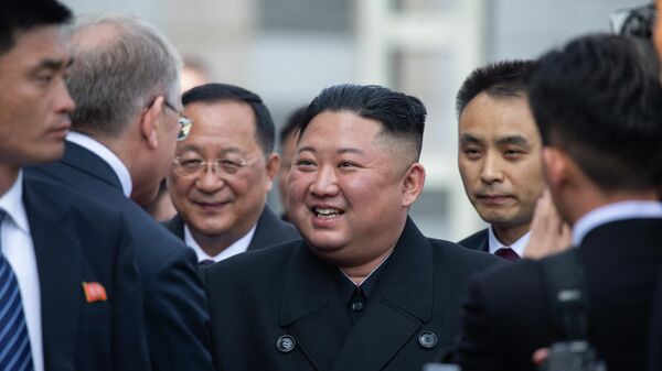 North Korea's leader Kim Jong-un smiles at a train station before departure from Vladivostok, Russia - Sputnik International