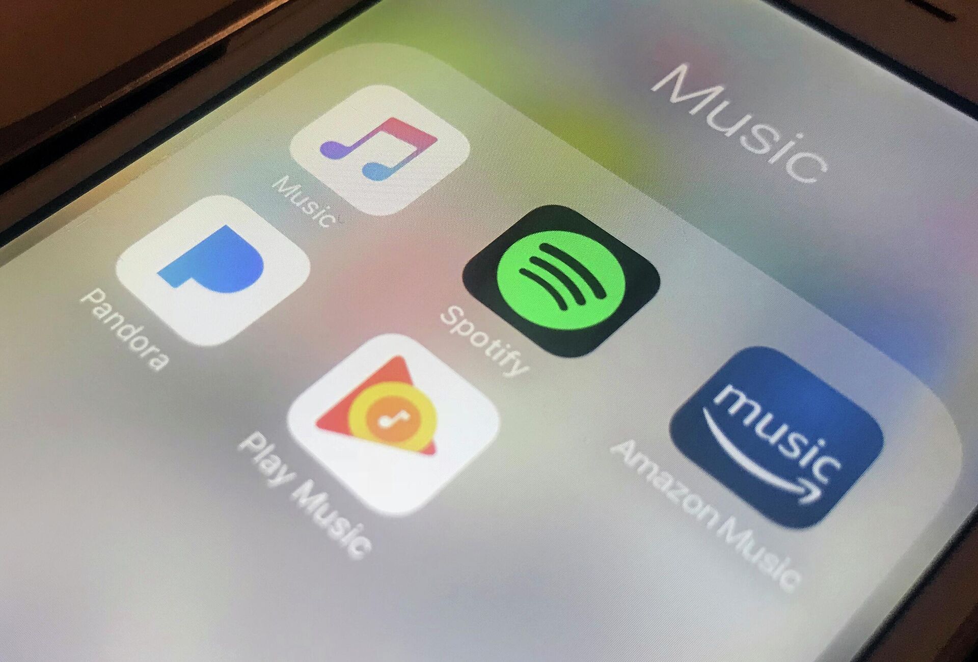 This Jan. 28, 2018, file photo shows music streaming apps clockwise from top left, Apple, Spotify, Amazon, Pandora and Google on an iPhone in New York.  - Sputnik International, 1920, 11.04.2022