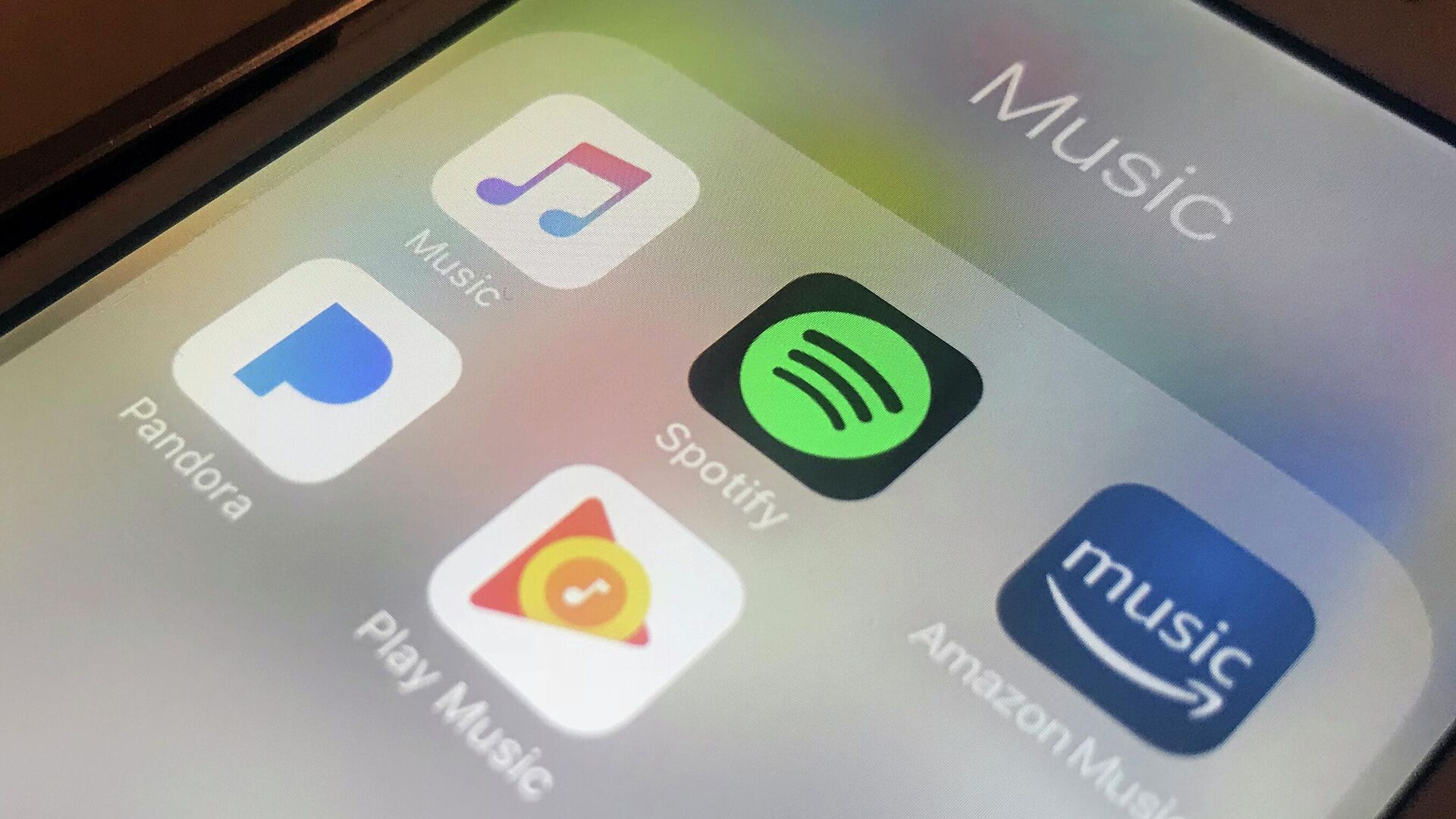 This Jan. 28, 2018, file photo shows music streaming apps clockwise from top left, Apple, Spotify, Amazon, Pandora and Google on an iPhone in New York.  - Sputnik International, 1920, 24.03.2023