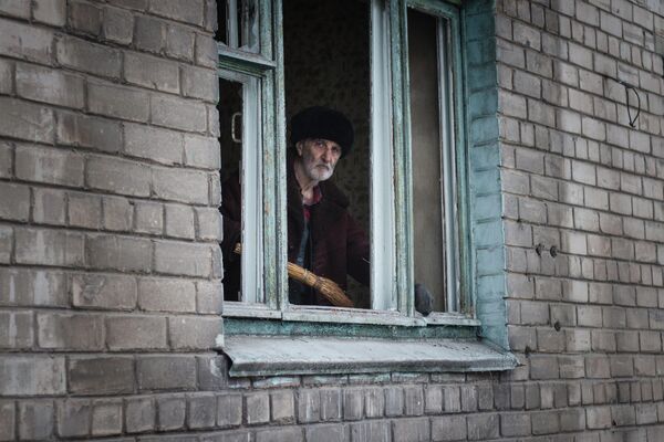 Since 2014, the Ukrainian regime has forced Donbass pensioners, many of whom have worked all their lives at local industrial giants and mines, to deal with humiliating &quot;pension tourism&quot;.Hundreds of thousands of people had to travel at their own expense to the &quot;Ukrainian side&quot;. They were forced to receive pensions, to register as &quot;temporarily displaced persons&quot; ( for a fee if you have no relatives or acquaintances in a particular city), to register almost every two months, to bribe officials to return before dark and not pay for a forced overnight stay. Photo: A resident of Donetsk in a house damaged in shelling by the Ukrainian military. - Sputnik International