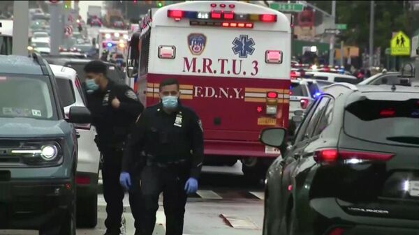 This still image provided by WABC shows law enforcement gathering at the scene of a shooting in the Brooklyn borough of New York on Tuesday, April 12, 2022.  - Sputnik International