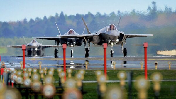 This US Department of Defense handout photo shows F-35A Lightning II's from the 34th Fighter Squadron at Hill Air Force Base, Utah, landing at Royal Air Force Lakenheath, England, April 15, 2017. - Sputnik International