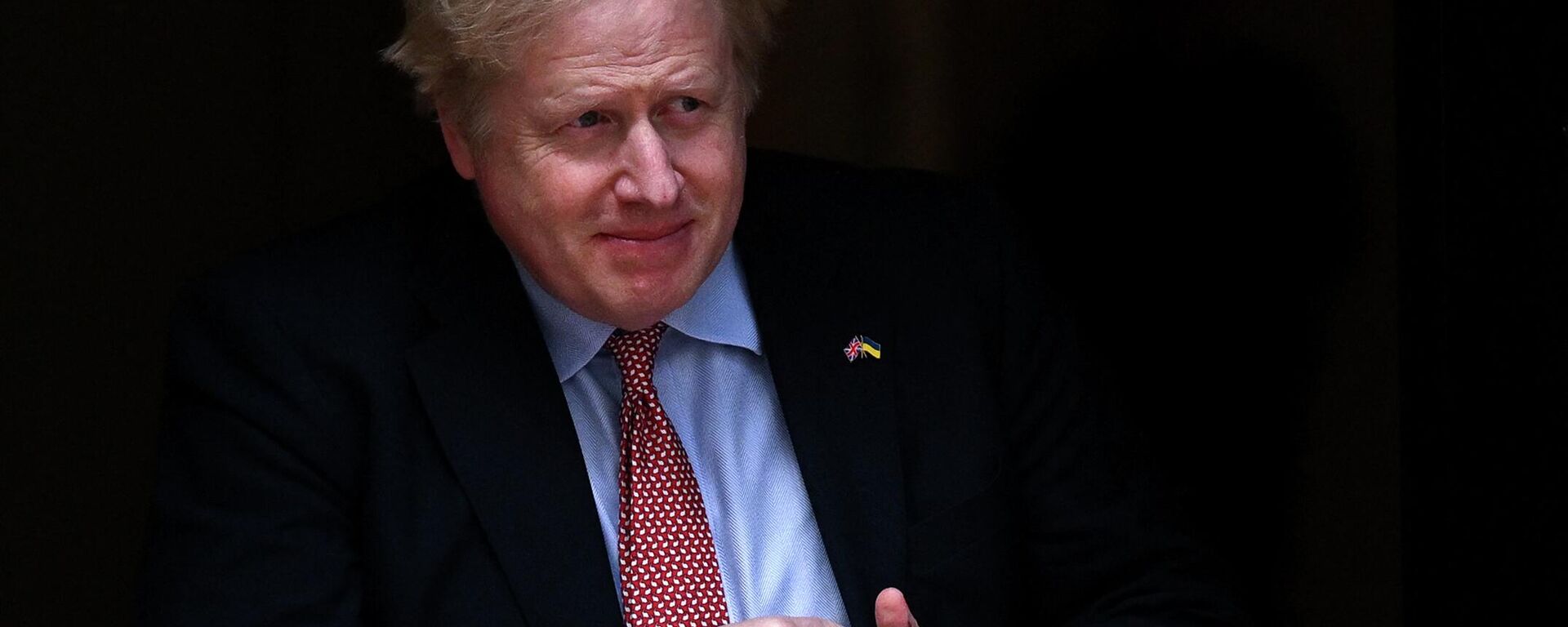 Britain's Prime Minister Boris Johnson walks out of number 10 Downing Street to greet the Polish president in London on April 7, 2022 - Sputnik International, 1920, 13.04.2022