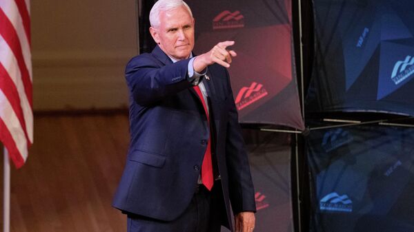 Former US Vice President Mike Pence points as he arrives to speak at a campus lecture hosted by Young Americans for Freedom at the University of Virginia in Charlottesville, Virginia, on April 12, 2022 - Sputnik International