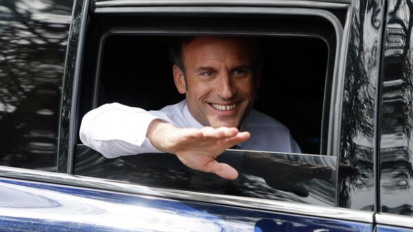 France's President and French liberal party La Republique en Marche (LREM) candidate to his succession Emmanuel Macron waves people as he leaves the Alister training center in rehabilitation and reeducation during a one-day campaign visit in the Grand-Est region, in Mulhouse, eastern France, on April 12, 2022 - Sputnik International