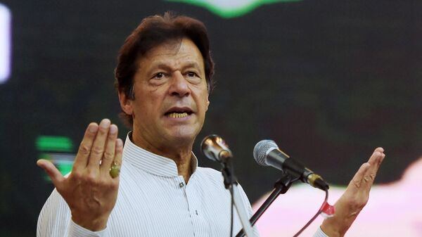 (FILES) This file photo taken on June 30, 2018 shows Pakistani cricketer-turned-politician and then-head of the Pakistan Tehreek-i-Insaf (PTI), Imran Khan, gesturing as he delivers a speech during an election campaign rally in Islamabad - Sputnik International