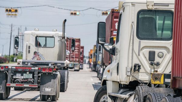 HOUSTON, TEXAS - JULY 29: Trucks transporting containers are shown at the Port of Houston on July 29, 2021 in Houston, Texas. - Sputnik International