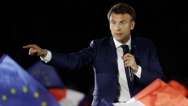 Current French President and centrist presidential candidate for reelection Emmanuel Macron delivers a speech during a campaign rally in Strasbourg, eastern France, Tuesday, April 12, 2022 . Macron, with strong pro-European views, and far-right candidate Marine Le Pen, an anti-immigration nationalist, are facing each other in the presidential runoff on April 24. (AP Photo/Jean-Francois Badias) - Sputnik International