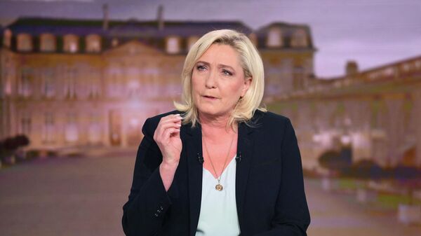 French far-right party Rassemblement National (RN) presidential candidate Marine Le Pen takes part in the evening news broadcast of French TV channel TF1, in Boulogne-Billancourt, outside Paris, on April 12, 2022. - Sputnik International