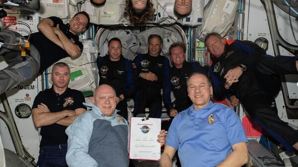 The 11-person crew aboard the station comprises of (clockwise from bottom right) Expedition 67 Commander Tom Marshburn with Flight Engineers Oleg Artemyev, Denis Matveev, Sergey Korsakov, Raja Chari, Kayla Barron, and Matthias Maurer; and Axiom Mission 1 astronauts (center row from left) Mark Pathy, Eytan Stibbe, Larry Conner, and Michael Lopez-Alegria - Sputnik International