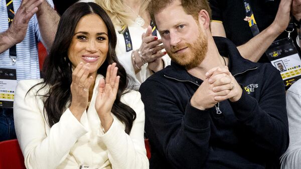 The Duke and Duchess of Sussex, Prince Harry and his wife Meghan Markle visit the sitting volleyball section of the fifth edition of the Invictus Games in The Hague on April 17, 2022 - Sputnik International