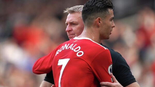 Norwich City's head coach Dean Smith, left, embraces Manchester United's Cristiano Ronaldo after the English Premier League soccer match between Manchester United and Norwich City at Old Trafford stadium in Manchester, England, Saturday, April 16, 2022.  - Sputnik International