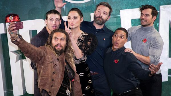 Actors Jason Momoa, from left, Ezra Miller, Gal Gadot, Ben Affleck, Ray Fisher and Henry Cavill pose for a selfie photograph at a photo call to promote the film 'Justice League', in London, Saturday, Nov. 3, 2017.  - Sputnik International