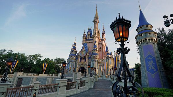 The newly painted Cinderella Castle at the Magic Kingdom at Walt Disney World is seen with the the crest to celebrate the 50th anniversary of the theme park Monday, Aug. 30, 2021, in Lake Buena Vista, Fla - Sputnik International
