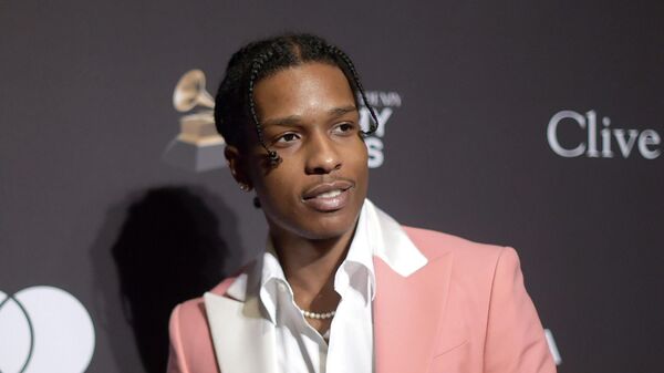 A$AP Rocky attends the Pre-Grammy Gala And Salute To Industry Icons on Feb. 9, 2019 in Beverly Hills, Calif.   A$AP Rocky was taken into custody Wednesday, April 20, 2022 at Los Angeles International Airport in connection with a shooting in Hollywood last year, authorities said. The performer, whose real name is Rakim Mayers, was detained on suspicion of assault with a deadly weapon, the Los Angeles Police Department said in a statement Wednesday. - Sputnik International