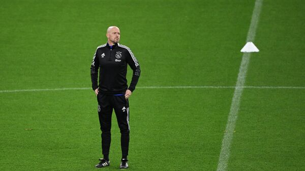 (FILES) In this file photo taken on November 2, 2021 Ajax Amsterdam's Dutch head coach Erik Ten Hag takes part in a training session in Dortmund, western Germany, on the eve of the UEFA Champions League, Group C, football match between Borussia Dortmund and Ajax Amsterdam. - - Sputnik International