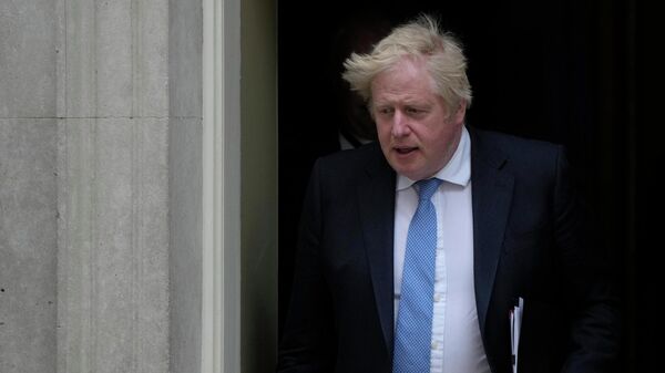 Britain's Prime Minister Boris Johnson leaves 10 Downing Street for the House of Commons to make a statement about Downing Street parties during the coronavirus lockdowns in London, Tuesday, April 19, 2022 - Sputnik International