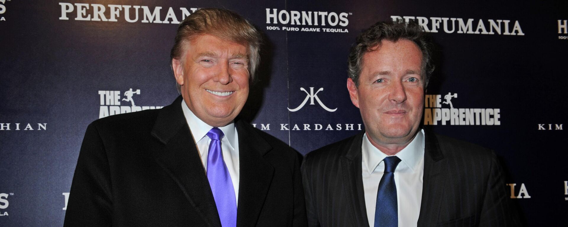 Donald Trump, left, and Piers Morgan arrive for the Perfumania party celebrating the appearance of Kim Kardashian on the reality show The Apprentice, Wednesday, Nov. 10, 2010, in New York. - Sputnik International, 1920, 21.04.2022