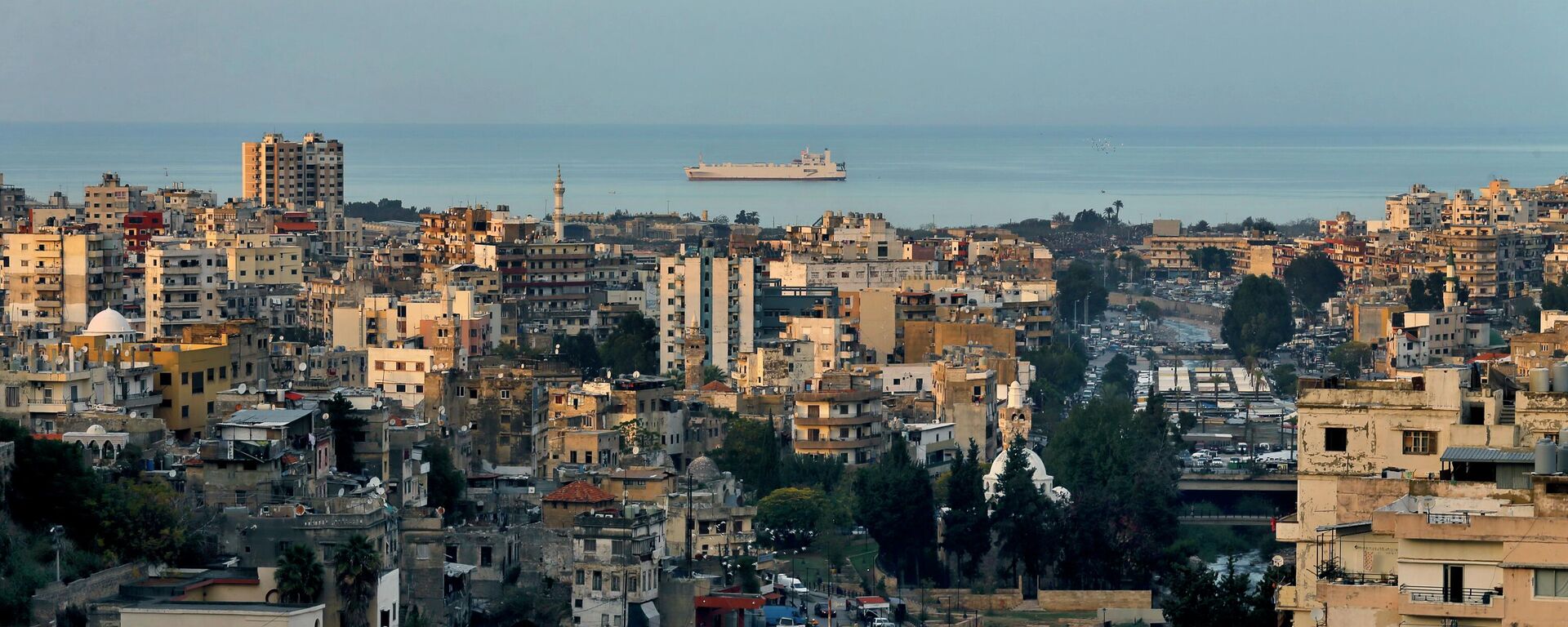 A cargo ship navigates the Mediterranean Sea along the coastline of northern city of Tripoli, Lebanon, Monday, Dec. 6, 2021. - Sputnik International, 1920, 23.09.2022