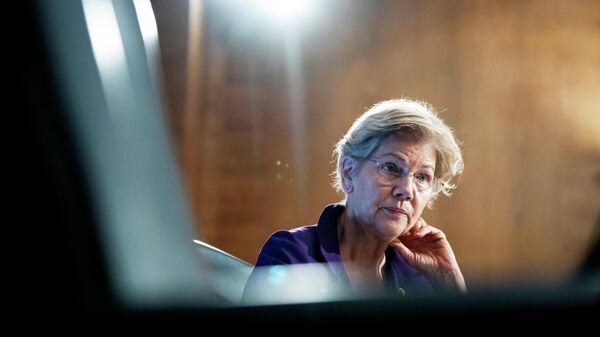 Sen. Elizabeth Warren, D-Mass., listens during a Senate Banking Committee hearing, Thursday, March 3, 2022 on Capitol Hill in Washington. - Sputnik International