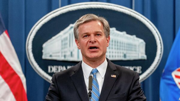 FBI Director Christopher Wray speaks at a news conference at the Justice Department in Washington, on Nov. 8, 2021. Wray says the threat to the West from the Chinese government is more brazen and damaging than ever before. In a speech on Jan. 31, 2022, at the Reagan Presidential Library in California, Wray accused Beijing of stealing American ideas and innovation and launching massive hacking operations.  - Sputnik International