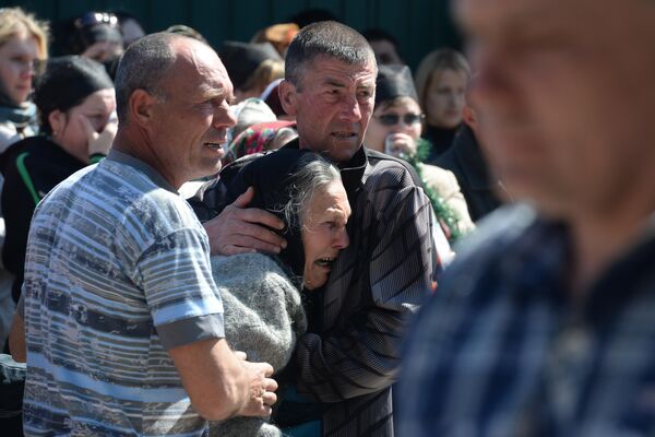 Thousands of families have lost relations in this ongoing conflict for the right to remain Russian.Photo: Residents of Donetsk region attend a memorial service for 21-year-old militiaman Aleksandr Lubenz, who was killed on 24 April during the shelling of a roadblock by the Ukrainian military. - Sputnik International
