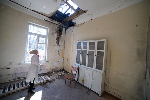 On 11 February 2015, a shell belonging to the Ukrainian armed forces hit Donetsk City Hospital No 20, according to what the Donetsk News Agency was told by the DPR Emergencies Ministry&#x27;s press office. The shells hit a neurology department and a laboratory for blood sampling. A nurse and seven people who were in the department received shrapnel wounds. A man who was walking on a bridge near the hospital at the time of the shelling was killed.Photo: a staff member inspecting the damage at Donetsk&#x27;s City Hospital No 20. - Sputnik International