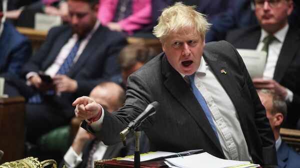 A handout photograph released by the UK Parliament shows Britain's Prime Minister Boris Johnson gesturing and speaking during during the Prime Minister's Questions (PMQ) session, in the House of Commons, in London, on April 27, 2022 - Sputnik International