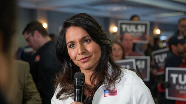 Democratic presidential candidate Rep. Tulsi Gabbard (D-HI) answers media questions following a campaign event on February 9, 2020 in Portsmouth, New Hampshire - Sputnik International