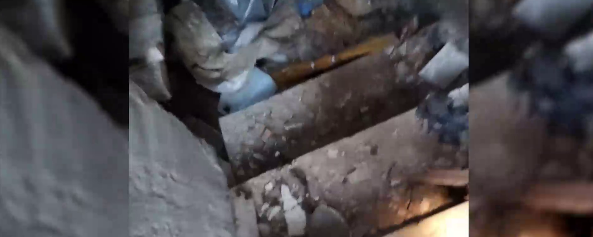 Still from grizzly video of torture chamber near Kherson, Ukraine containing body of what Russian investigators fear is a Russian servicemen tortured to death by Ukrainian troops or nationalist formations. - Sputnik International, 1920, 03.05.2022