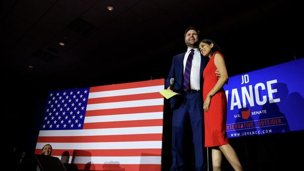 Republican Senate candidate JD Vance, left, is hugs his wife Usha Vance, as he prepares to speak to supporters during an election night watch party, Tuesday, May 3, 2022, in Cincinnati. - Sputnik International