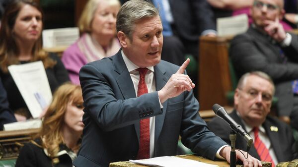 A handout photograph released by the UK Parliament shows Britain's  Labour Party leader Keir Starmer gesturing and speaking during during the Prime Minister's Questions (PMQ) session, in the House of Commons, in London, on April 27, 2022 - Sputnik International