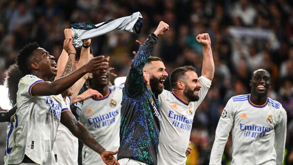 Real Madrid players celebrate their victory at the end of the UEFA Champions League semi-final second leg football match between Real Madrid CF and Manchester City at the Santiago Bernabeu stadium in Madrid on May 4, 2022 - Sputnik International