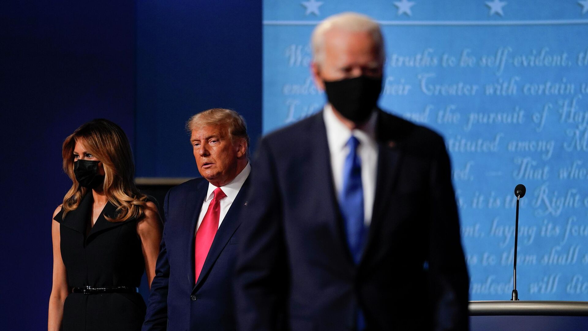 In this Oct. 22, 2020, file photo first lady Melania Trump, left, and President Donald Trump, center, remain on stage as Democratic presidential candidate former Vice President Joe Biden, right, walk away at the conclusion of the second and final presidential debate at Belmont University in Nashville, Tenn. - Sputnik International, 1920, 13.07.2022