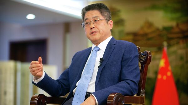 Chinese Vice Minister of Foreign Affairs Le Yucheng speaks during an interview with the Associated Press at the Ministry of Foreign Affairs in Beijing, Friday, April 16, 2021. - Sputnik International