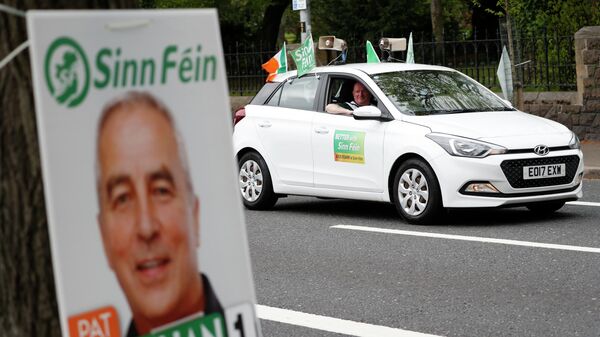 A Sinn Fein canvassing car plays music on the Falls road in West Belfast, Northern Ireland, Thursday May 5, 2022 - Sputnik International