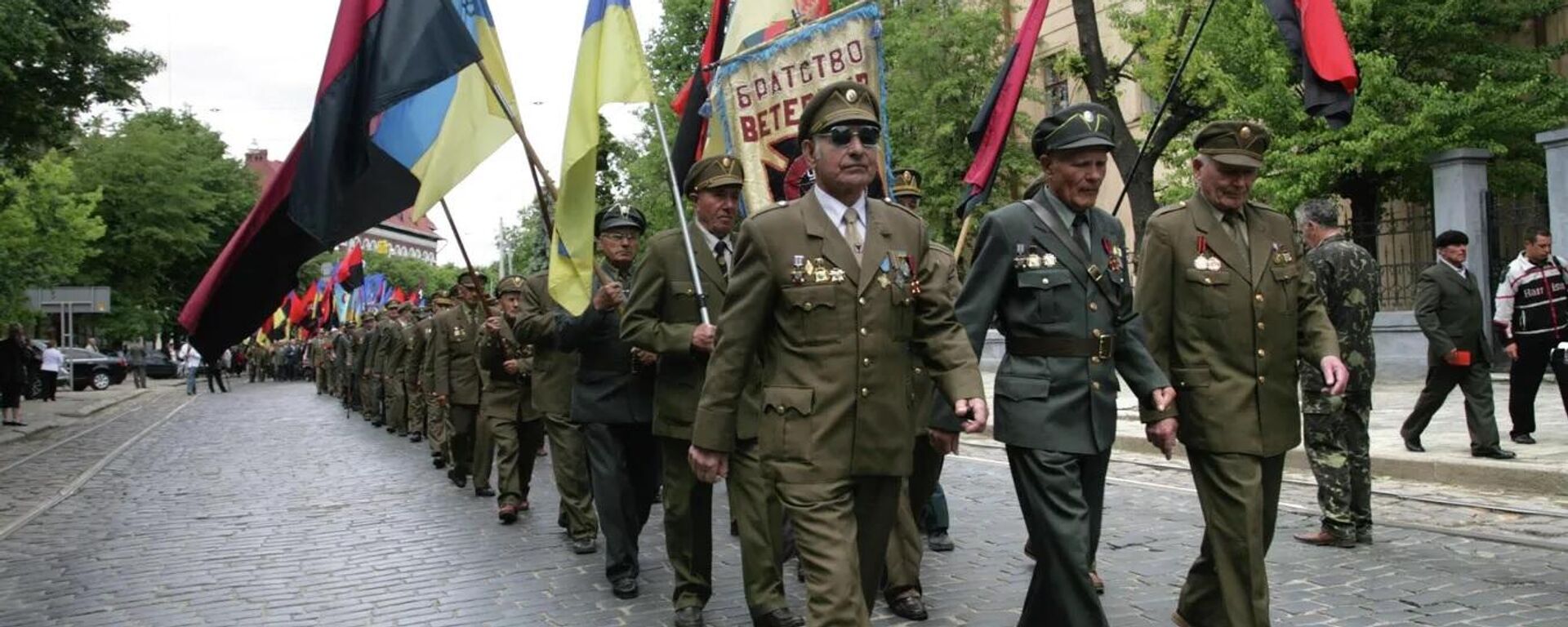 Veterans of the Ukrainian Insurgent Army (UPA, an extremist organisation banned in Russia) march to a monument to Stepan Bandera on “Heroes' Day” in central Lvov, 2019. Members of the OUN-UPA* became notorious for their atrocities during the Great Patriotic War and are honoured as heroes in modern Ukraine. *The Ukrainian Insurgent Army (or OUN-UPA*) is an extremist organisation banned in Russia since 2014.
 - Sputnik International, 1920, 01.07.2023