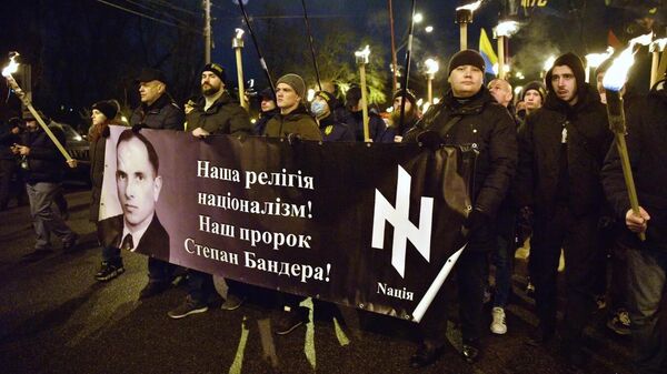 Marchers celebrating the 112th anniversary of the birth of Nazi outlaw Stepan Bandera in Kiev. Ukrainian neo-Nazis modelled their torchlight marches after the ones that took place in Hitler's Germany and attended them with their families. - Sputnik International