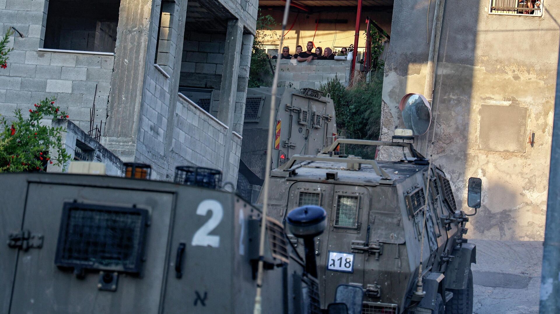 Israeli forces' vehicles drive during a raid on a house in the town of Rummanah, near the flashpoint town of Jenin in the occupied West Bank on May 8, 2022, reportedly the home of Palestinian Subhi Imad Abu Shukair, suspected of carrying out a fatal axe attack in the central city of Elad two days earlier. - Sputnik International, 1920, 09.05.2022