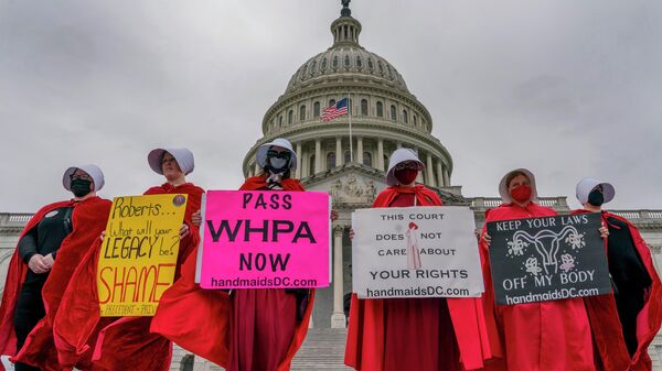 Abortion-rights protesters display placards during a demonstration outside the U.S. Capitol, Sunday, May 8, 2022, in Washington. - Sputnik International