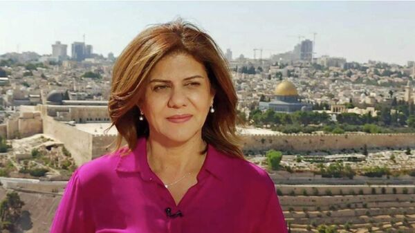 An undated handout photo released by the Doha-based Al-Jazeera TV shows the channel's veteran journalist Shireen Abu Aqleh (Akleh) during one of her reports from Jerusalem. - Sputnik International