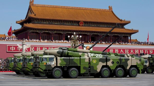 Chinese military vehicles carrying DF-21D anti-ship ballistic missiles, potentially capable of sinking a U.S. Nimitz-class aircraft carrier in a single strike, drive past Tiananmen Gate during a military parade to commemorate the 70th anniversary of the end of World War II, in Beijing on Sept. 3, 2015. - Sputnik International