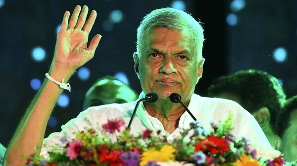 (FILES) In this file photo taken on August 02, 2020 United National Party (UNP) party leader Ranil Wickremesinghe waves to supporters during the party's final campaign rally ahead of the upcoming parliamentary elections in Colombo - Sputnik International