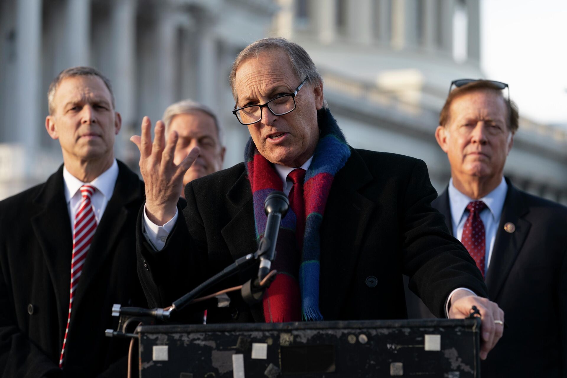 Freedom Caucus chairman Rep. Andy Biggs, R-Ariz., center, speaks next to Rep. Scott Perry, R-Pa., left, and Randy Weber, R-Texas, right, on Capitol Hill, Thursday, Dec. 3, 2020, in Washington. - Sputnik International, 1920, 12.05.2022