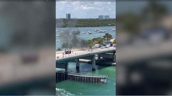 A screenshot from the social media video of a single-engine plane crash in Miami, Florida, on May 14, 2022. - Sputnik International